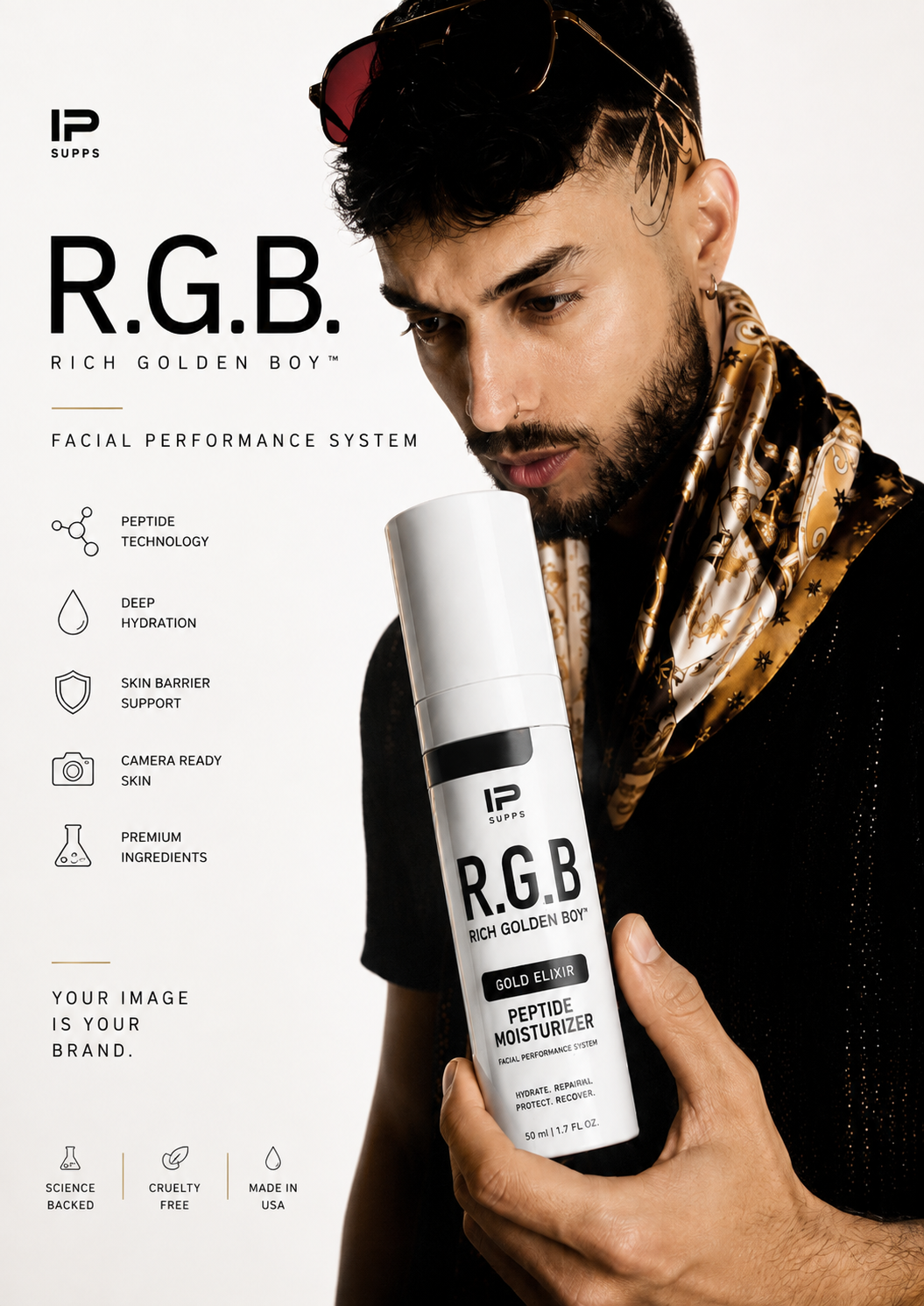 R.G.B. Rich Golden Boy peptide moisturizer held by artist Rizh